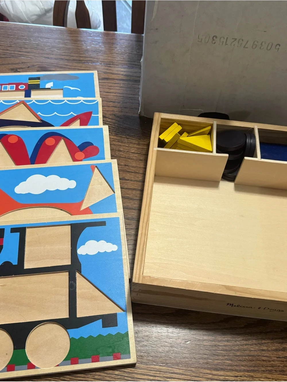 Melissa & Doug Wooden Shape Puzzle Set - Blue, Yellow, Red, Black